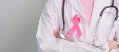 Pink October Breast Cancer Awareness month, doctor with pink Ribbon in hospital for support people life and illness. National cancer survivors month, Mother and World cancer day concept
